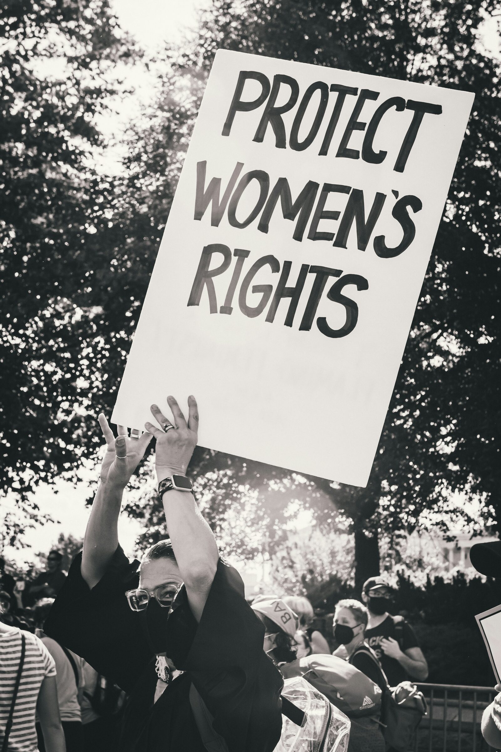 Protester holding a sign reading protect women's rights